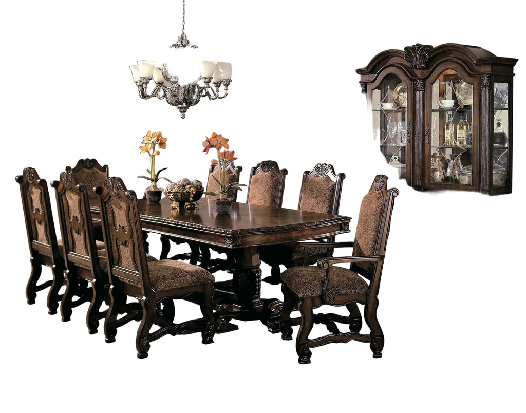 Dining room with wooden table and chairs, large china cabinet, and decorative elements.