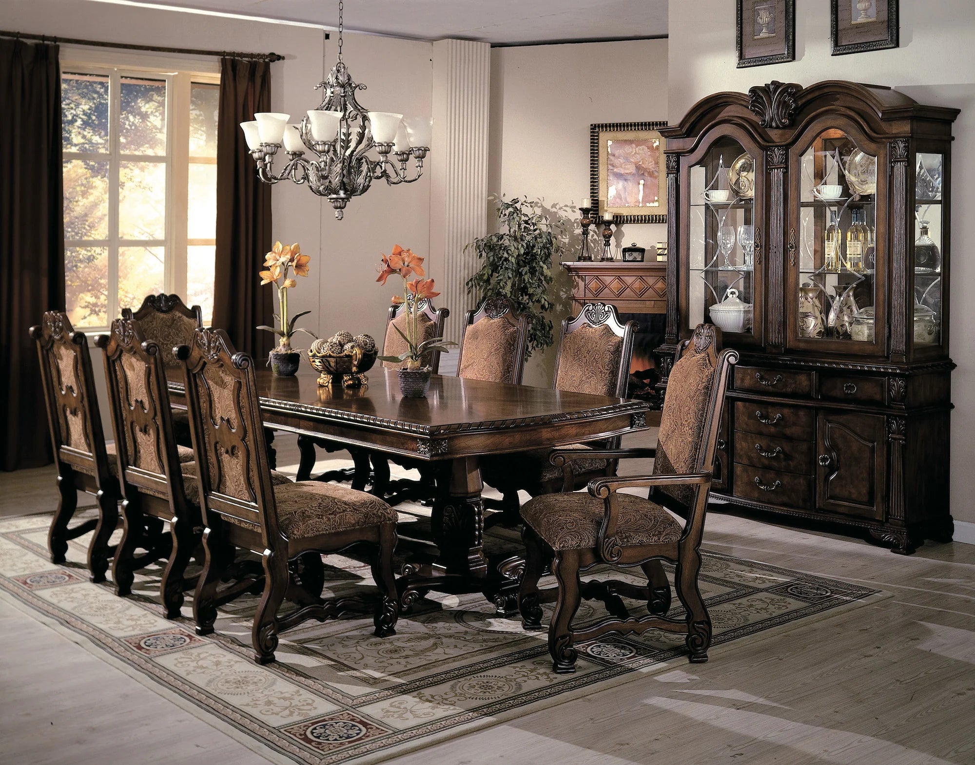 Dining room with wooden table and chairs, large china cabinet, and decorative elements.