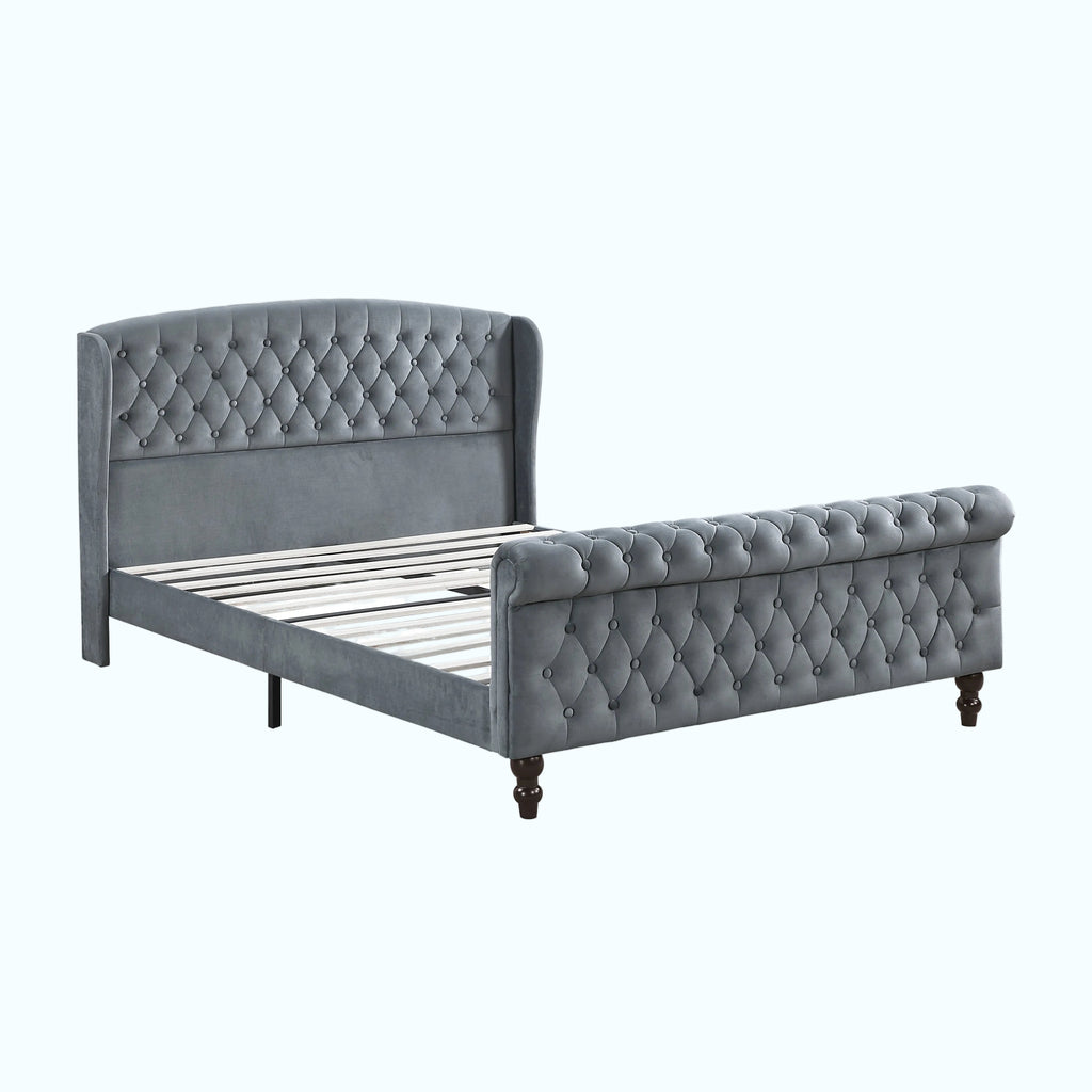A gray tufted velvet bed frame with a wingback headboard and matching footboard, shown on a white background.