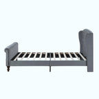 A gray upholstered bed frame with a tall wingback headboard and matching footboard, shown on a plain white background.