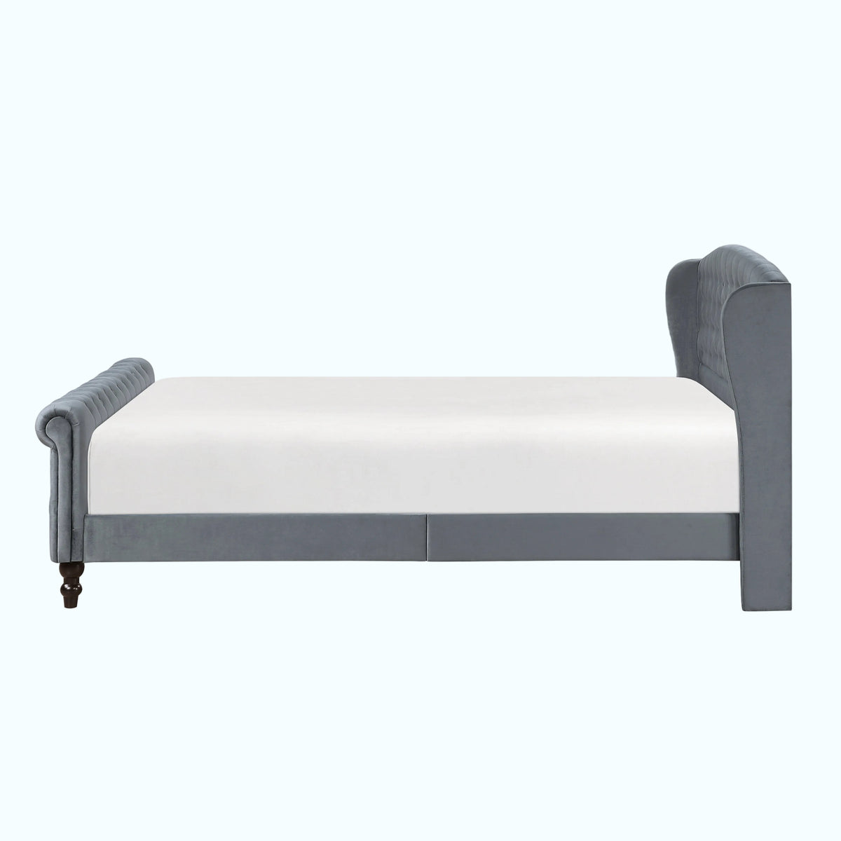A gray upholstered bed frame with a white mattress, shown from a side profile view against a plain white background.