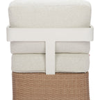 Stack of beige towels in a woven basket on a white background