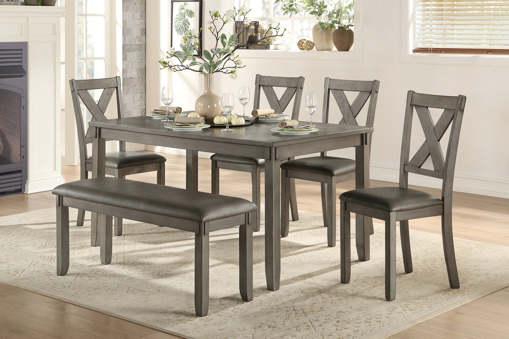 Dining room set with gray table and chairs in a home setting.