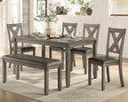 Dining room set with gray table and chairs in a home setting.