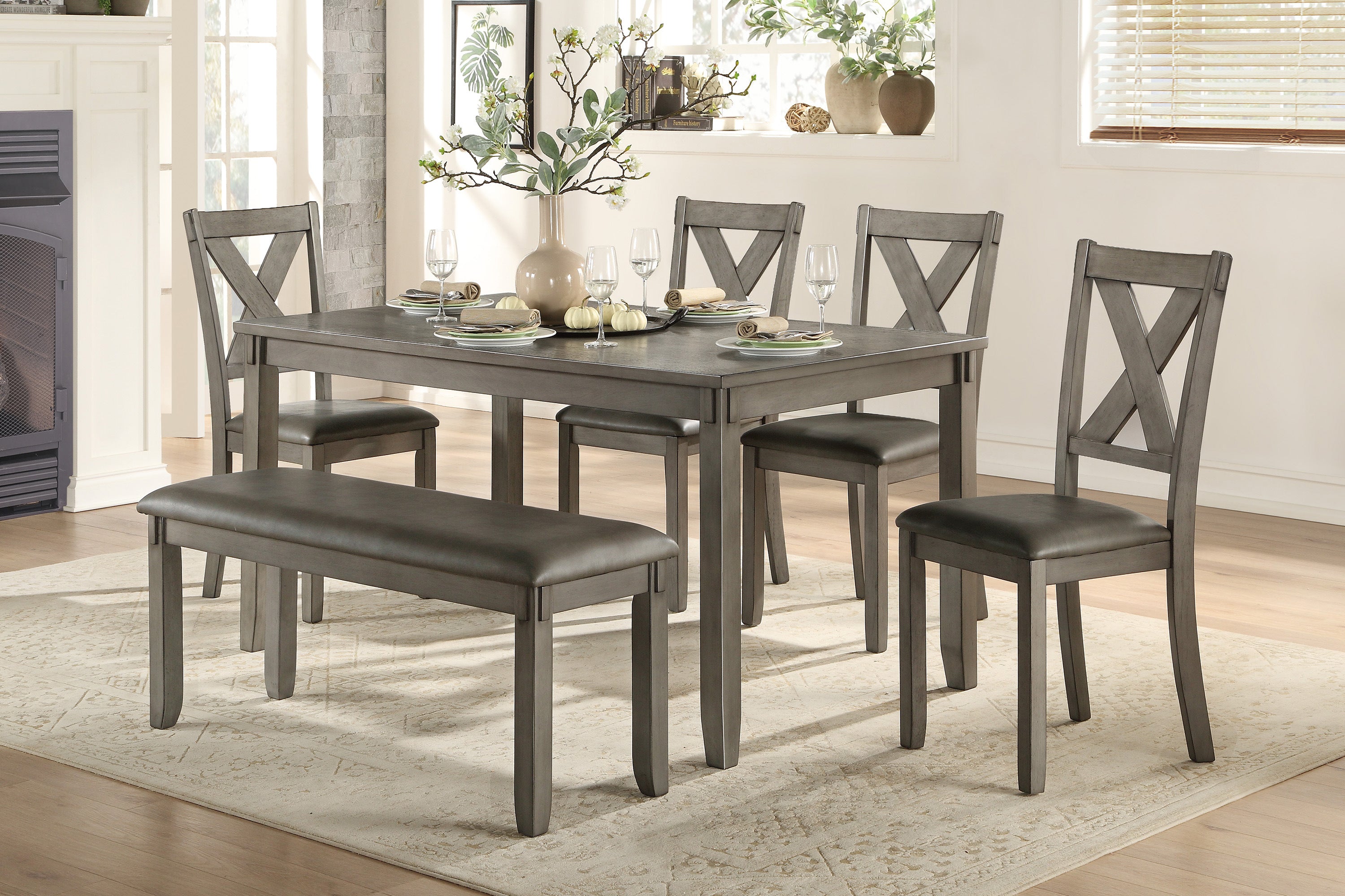 Dining room set with gray table and chairs in a home setting.