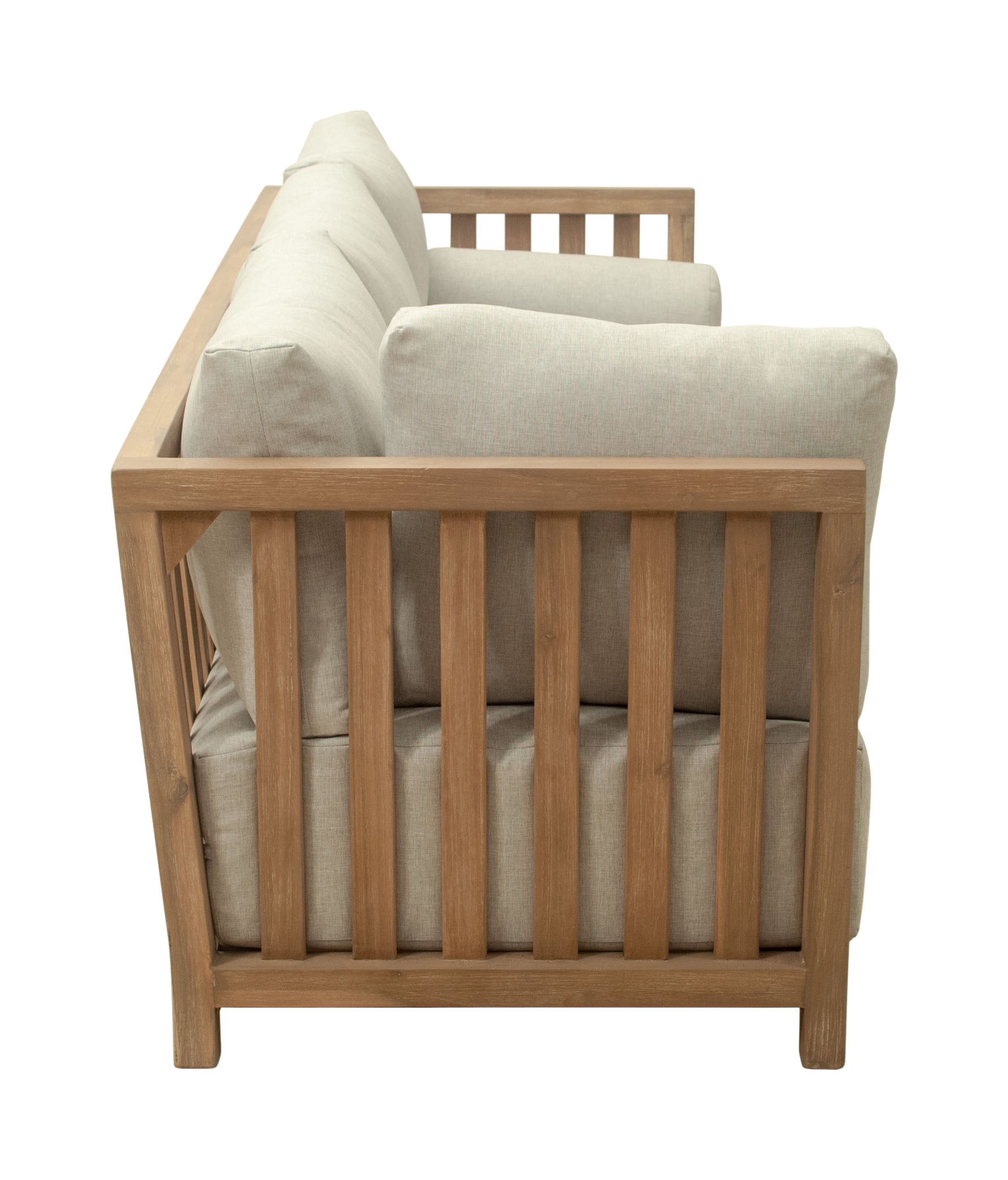 Wooden crib with beige mattress and pillows on a white background