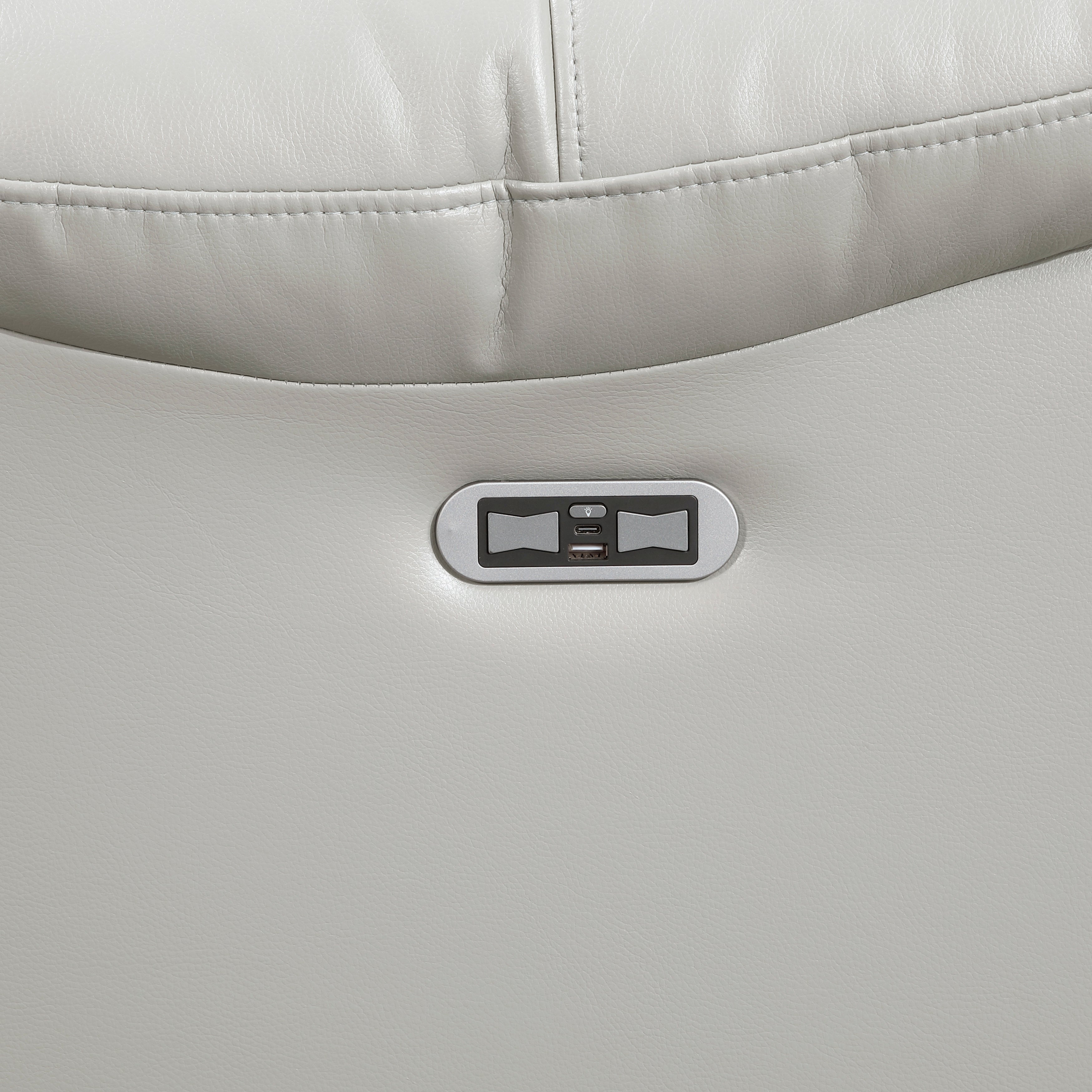 Gray cushion with a control panel featuring buttons and a display on a matching gray background.