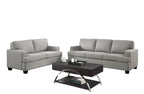 Gray sofa set in a living room with cityscape view