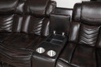 Brown leather recliner with cup holders and armrests