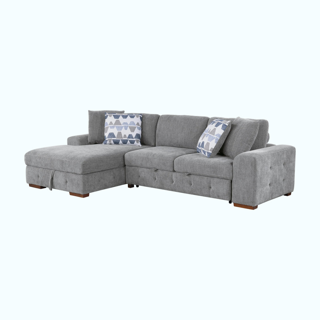 Gray sectional sofa with patterned cushions on a white background