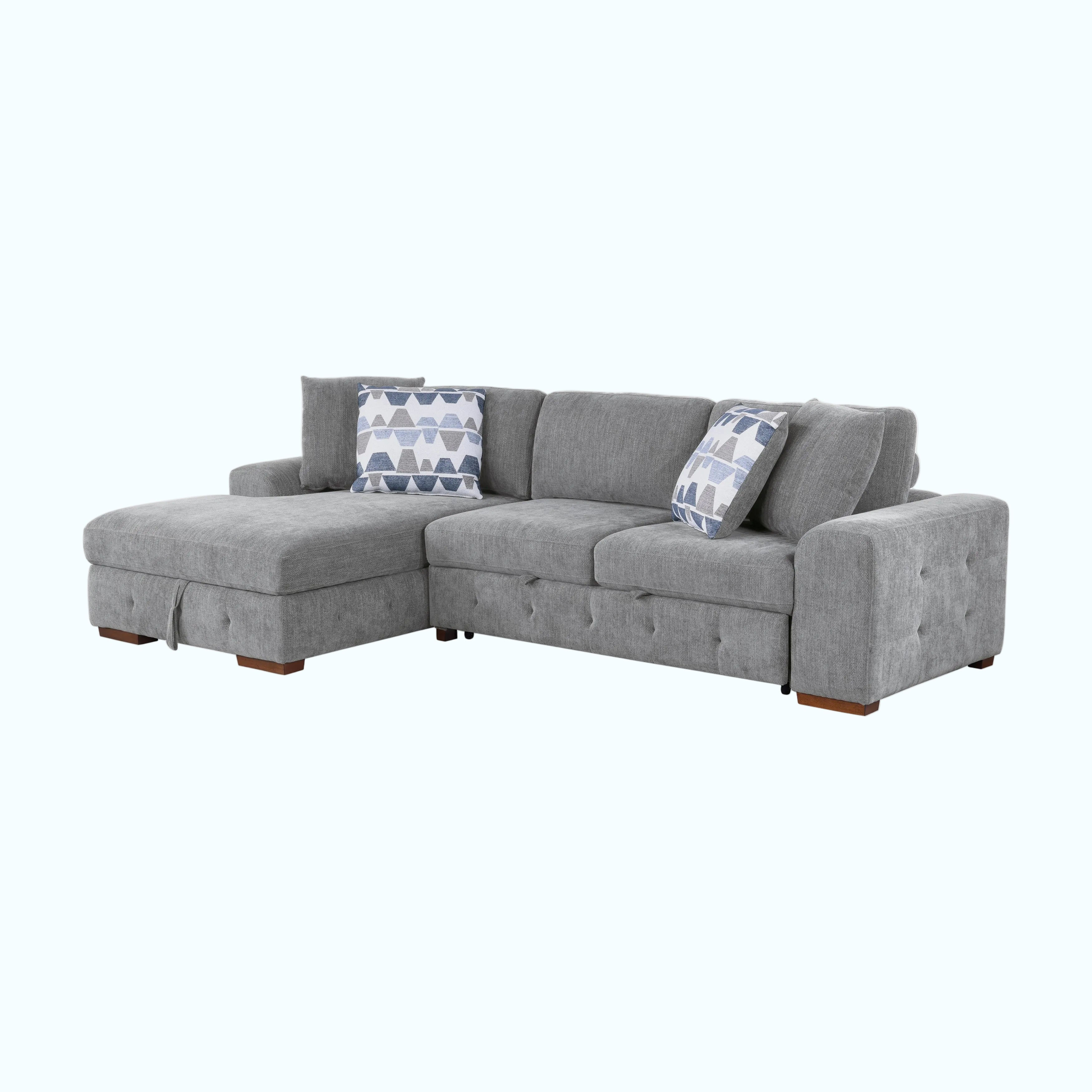 Gray sectional sofa with patterned cushions on a white background