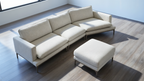 Beige sectional sofa with ottoman on a wooden floor
