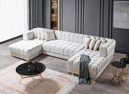 Modern white sectional sofa in a stylish living room with decor elements.