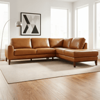 Brown leather sectional sofa in a modern living room with large windows.