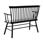 Black metal bench with slatted backrest on a white background