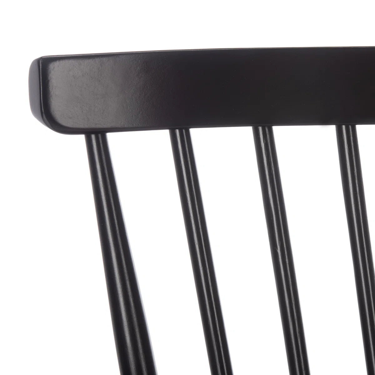 Close-up of a black chair backrest on a white background