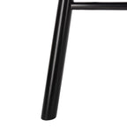 Close-up of a black metal chair leg on a white background