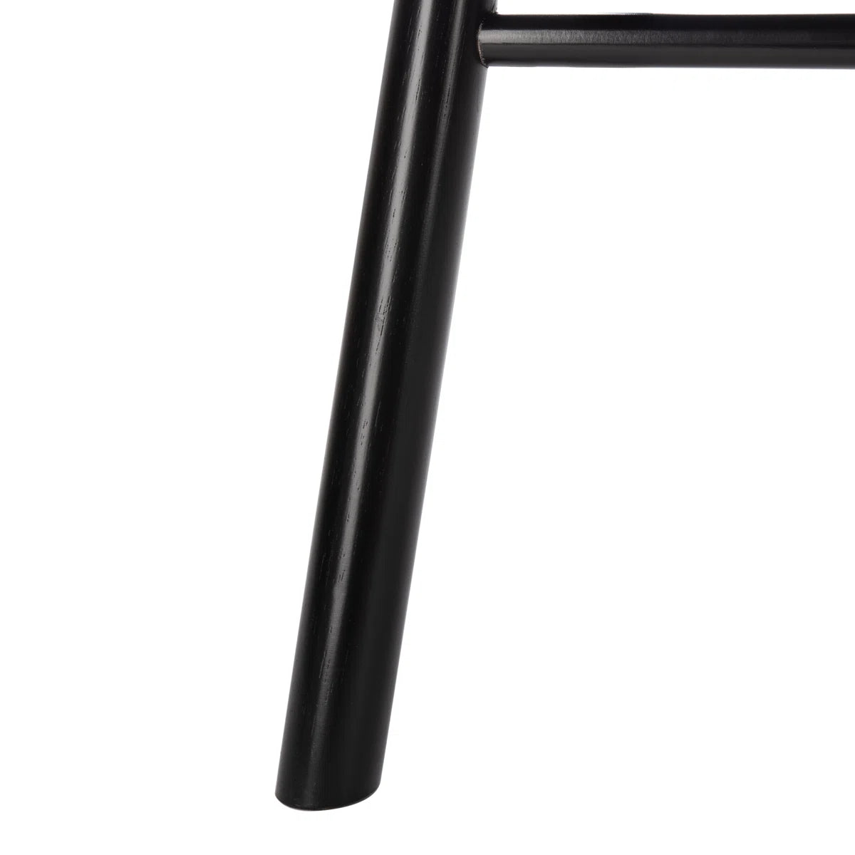 Close-up of a black metal chair leg on a white background
