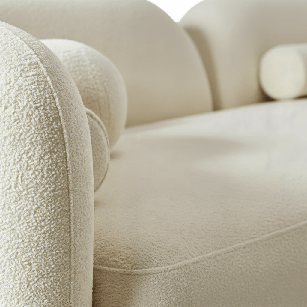 Close-up of a beige textured sofa with a blurred background