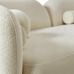 Close-up of a beige textured sofa with a blurred background