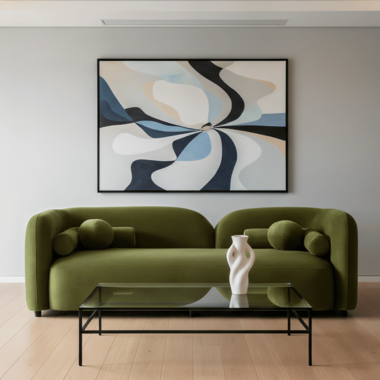 Modern living room with a green sofa, abstract painting, and glass coffee table.
