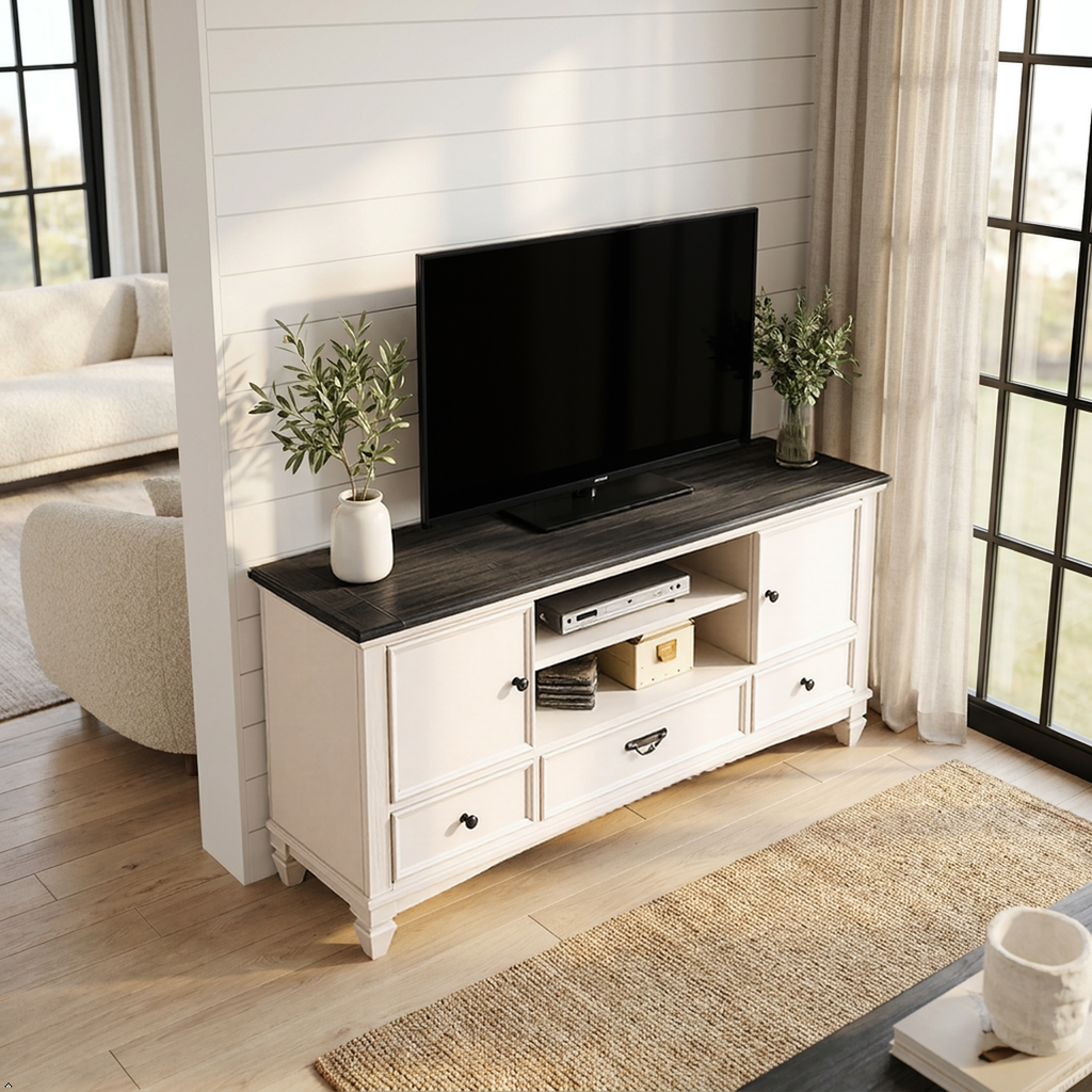 White TV stand with a black television in a living room setting.