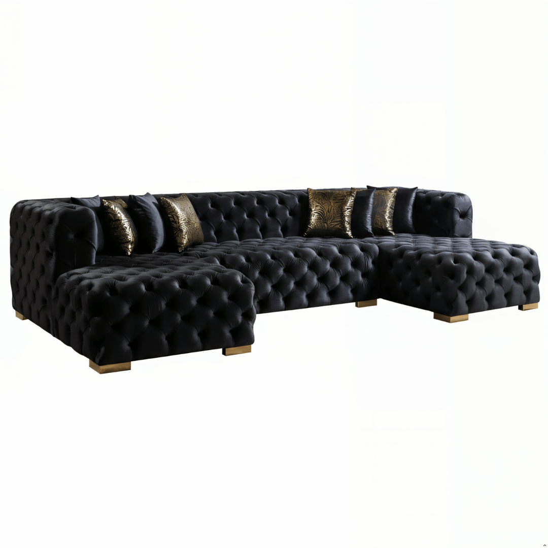 Black tufted sofa with decorative pillows on a white background
