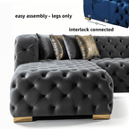 Gray tufted sofa with gold legs and cushions on a white background