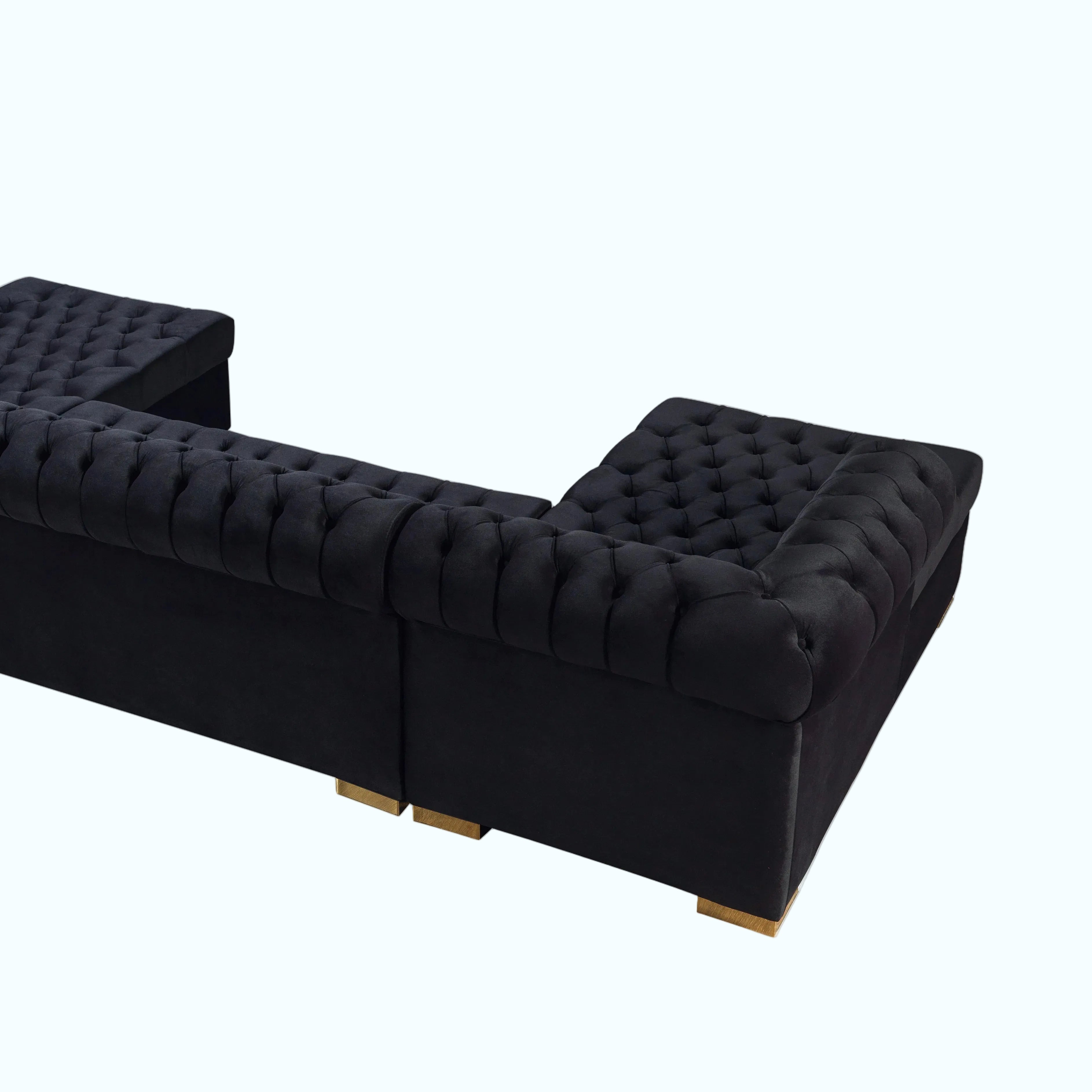 Black tufted sofa on a white background