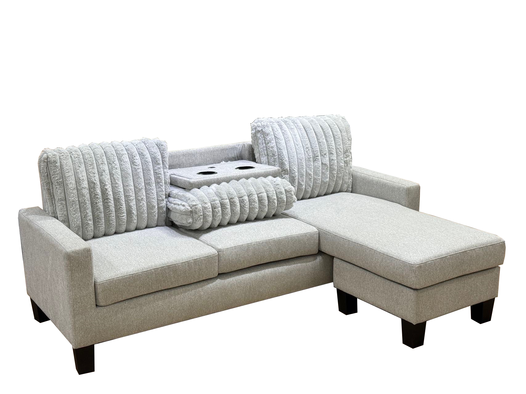 Gray sectional sofa with decorative pillows on a white background