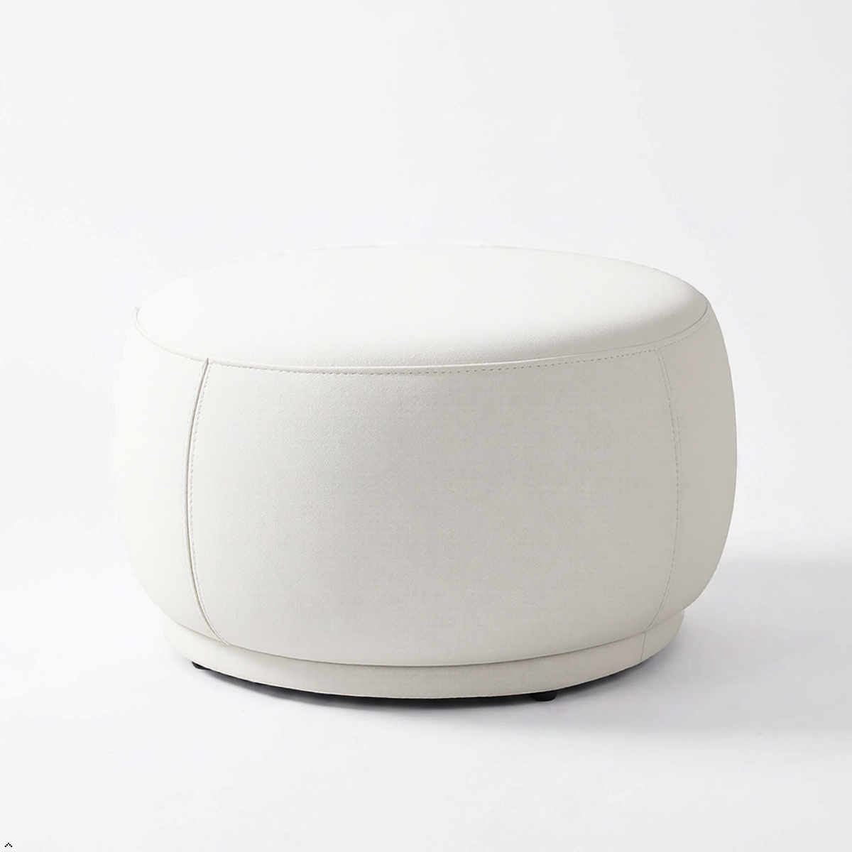 White round ottoman on a white background