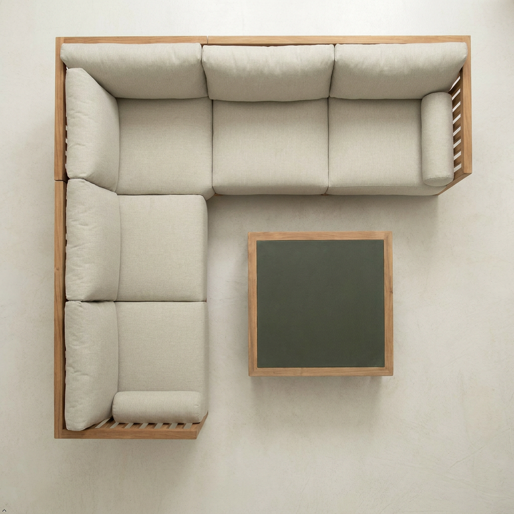 Beige sectional sofa with wooden frame and small table on a white background