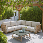 Outdoor patio with wooden sectional sofa and coffee table under a pergola