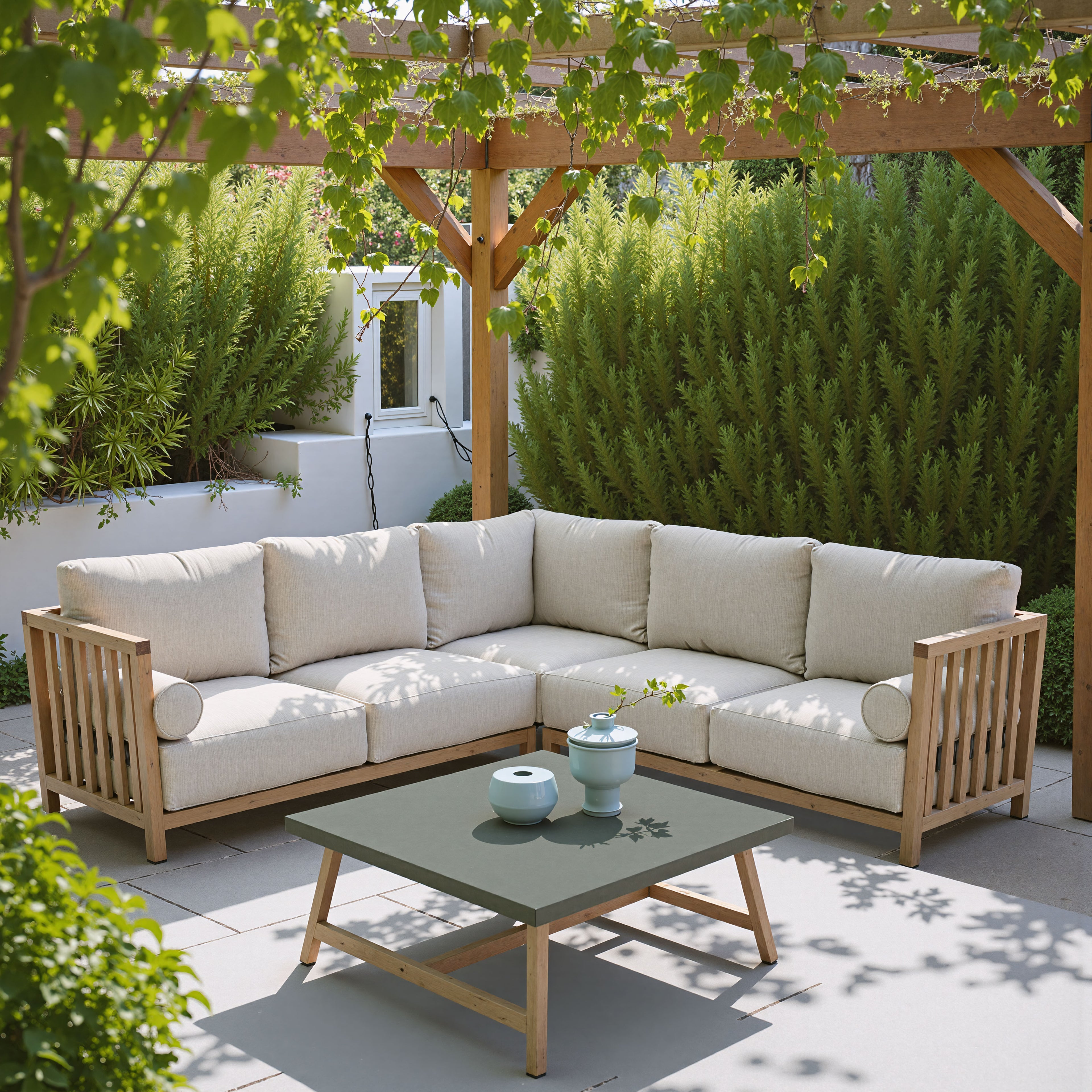 Outdoor patio with wooden sectional sofa and coffee table under a pergola