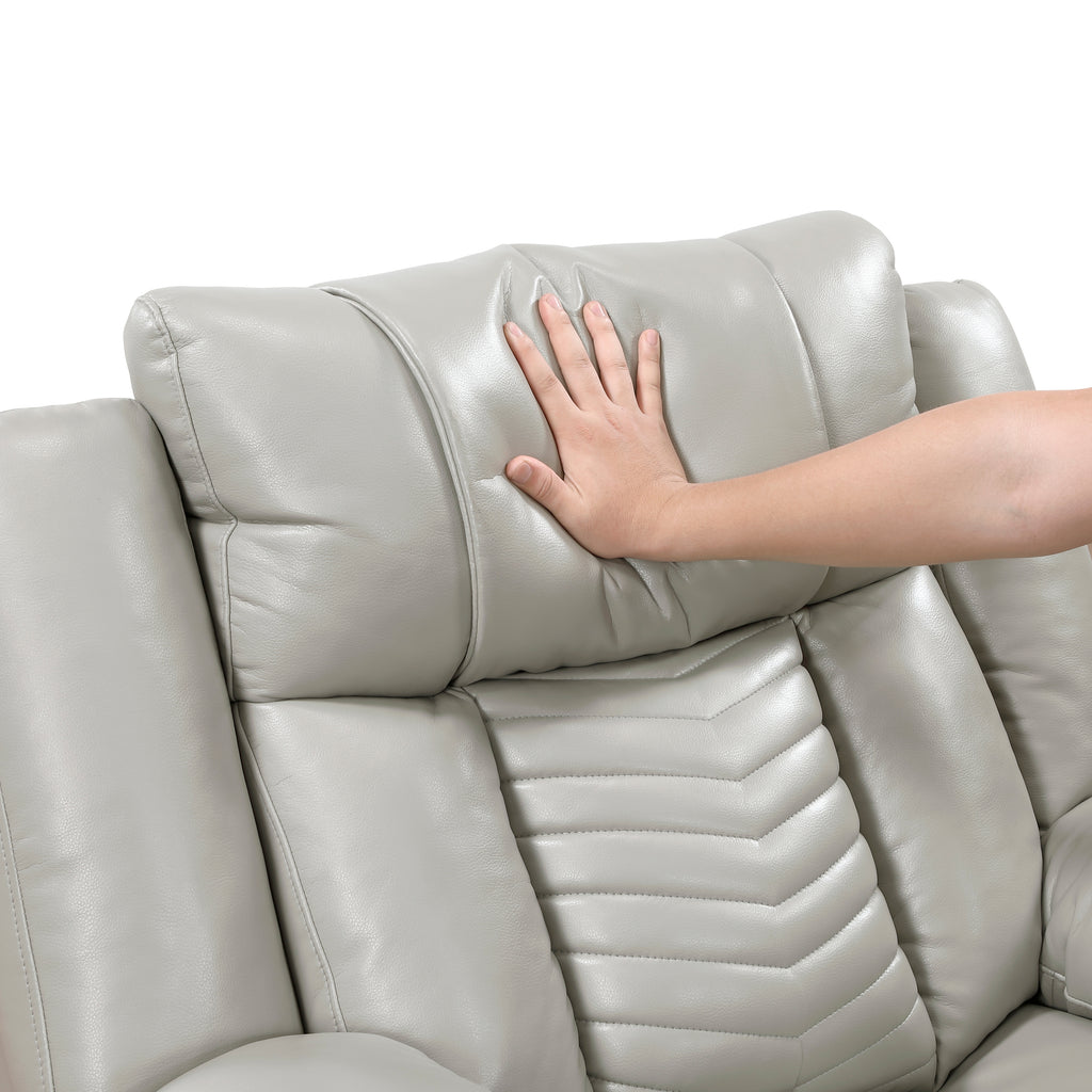 Hand touching a light gray leather sofa on a white background