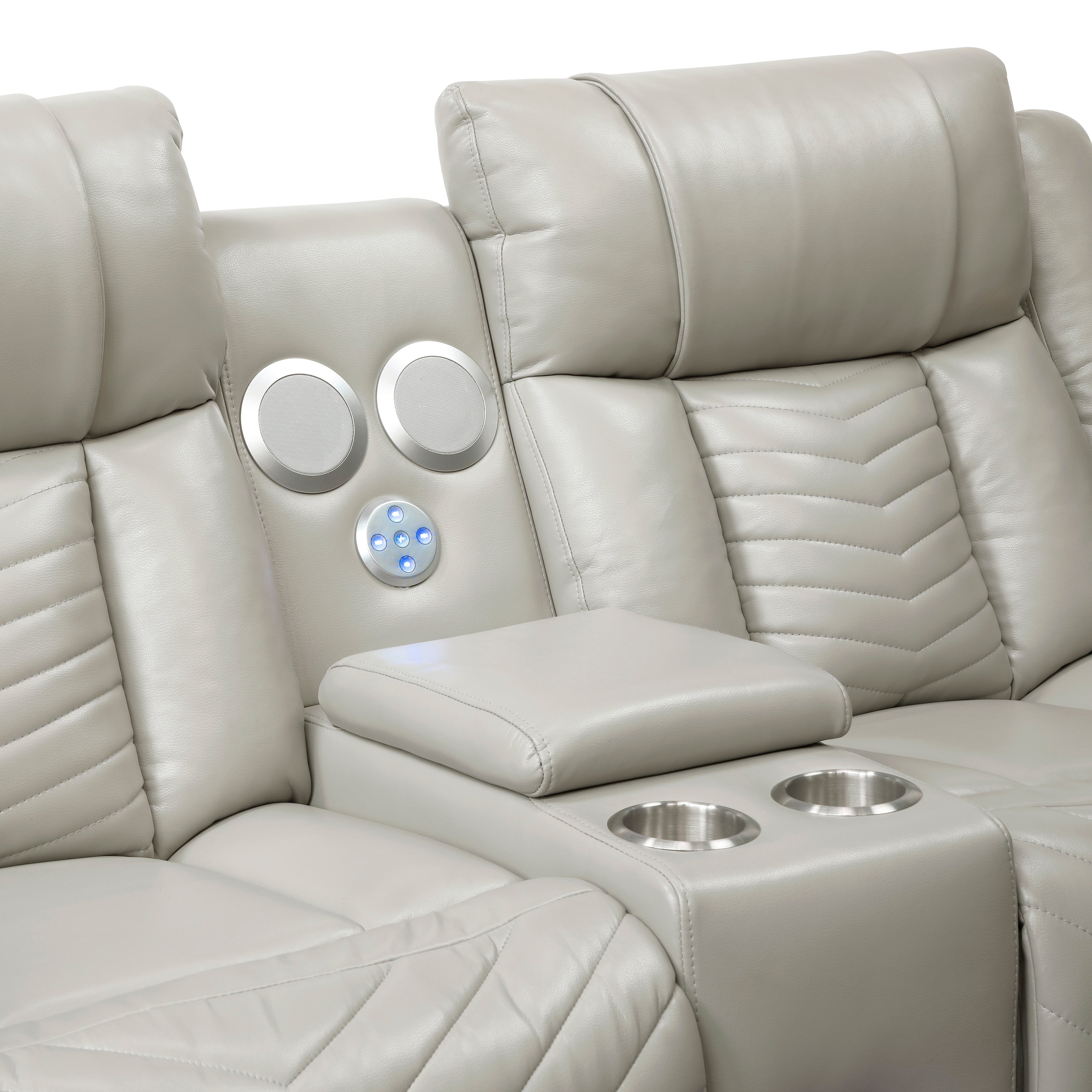 Beige leather recliner with cup holders and speakers on a white background