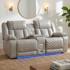 Gray recliner sofa with built-in speakers in a living room setting.