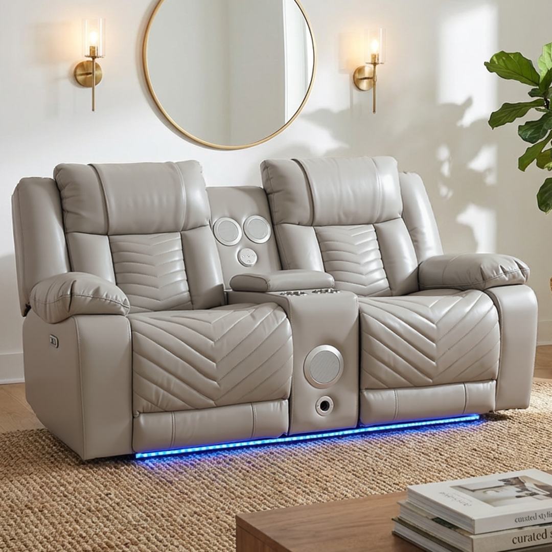 Gray recliner sofa with built-in speakers in a living room setting.