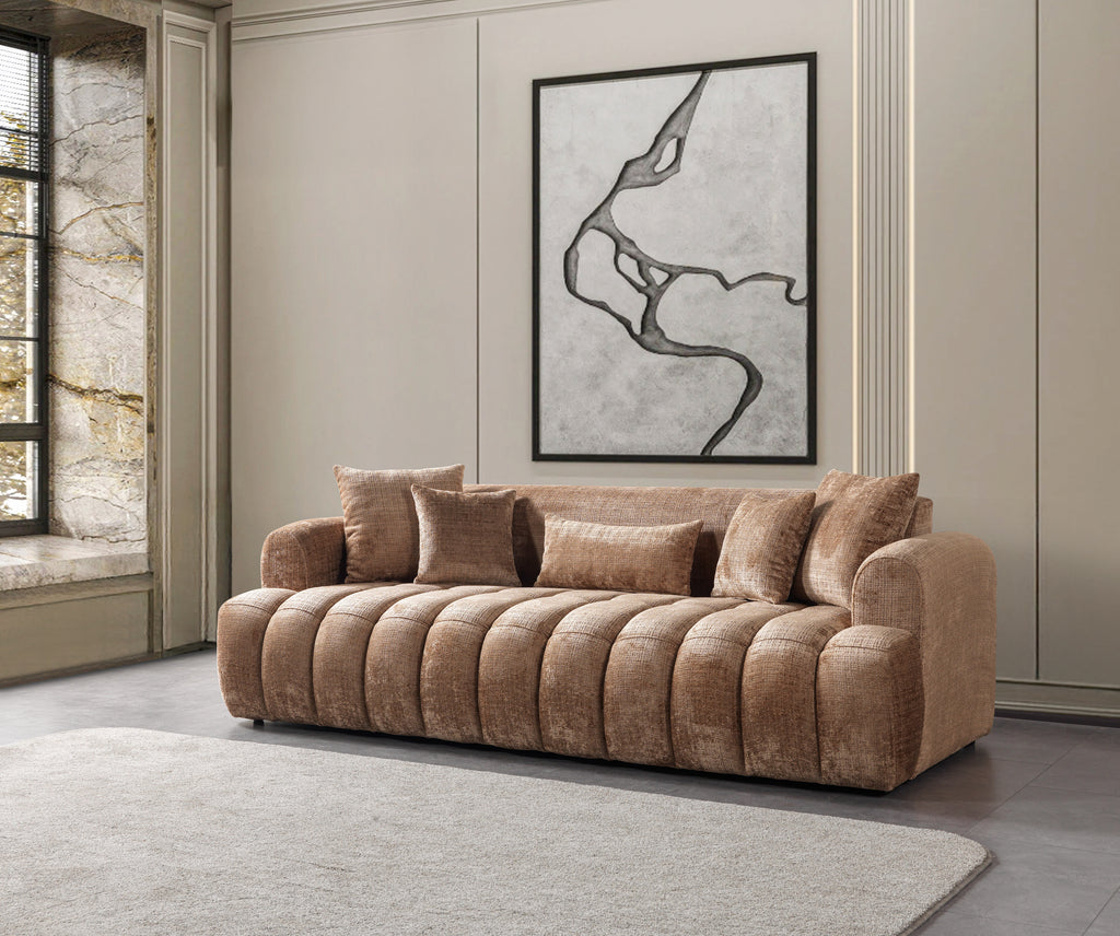 Brown sofa in a living room with a abstract painting on the wall.