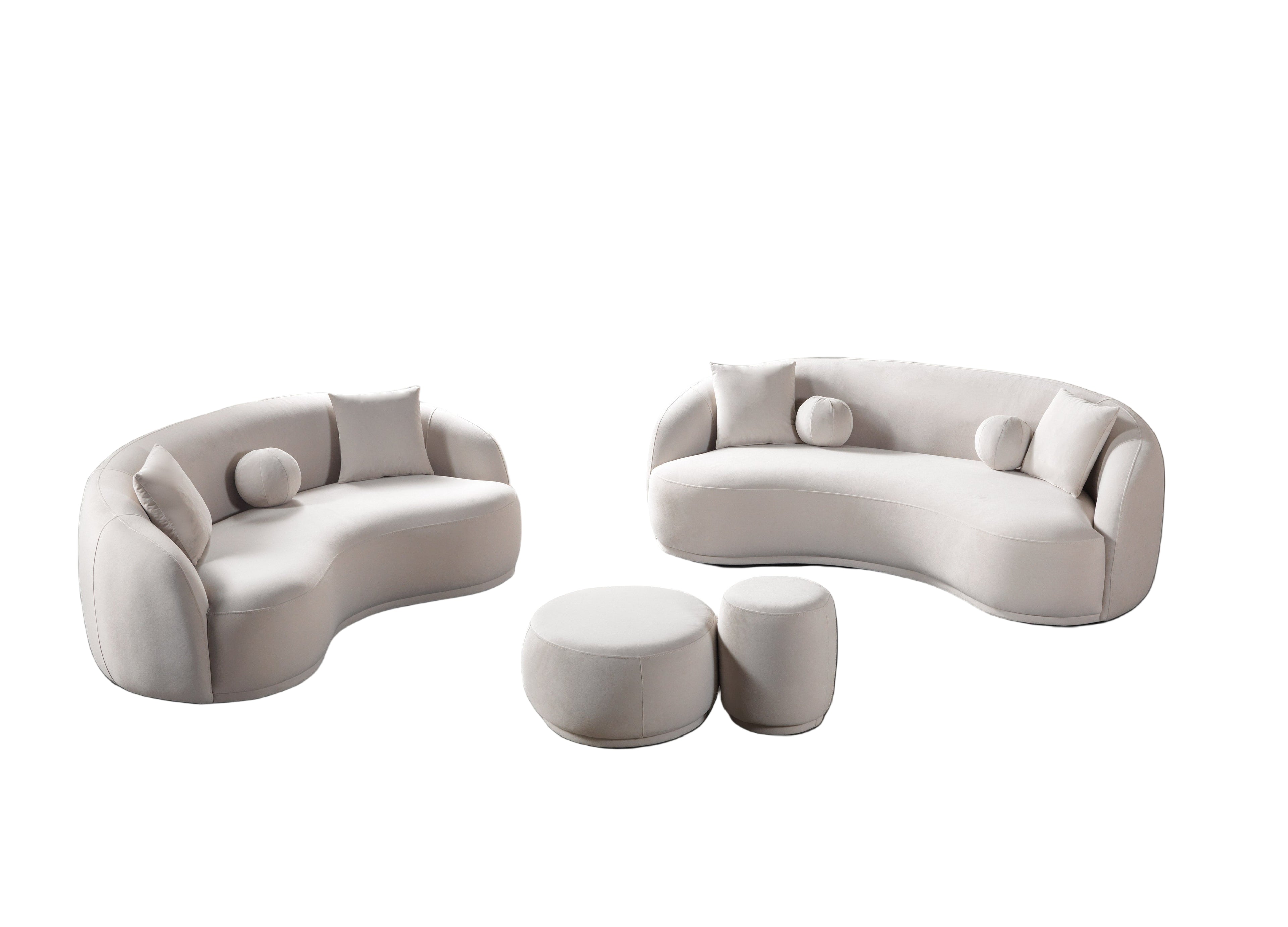 Modern living room with curved white sofas and matching ottomans on a gray rug.