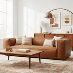 Modern living room with a brown leather sofa, wooden coffee table, and abstract art on the wall.