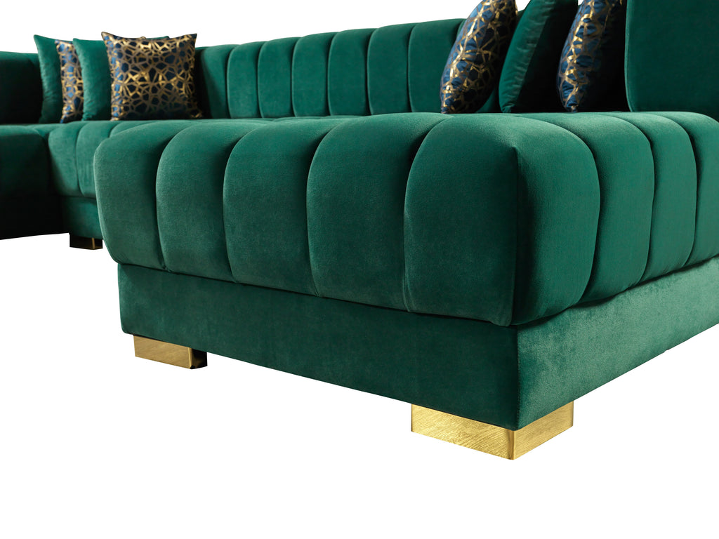 Green velvet sofa with gold legs on a white background