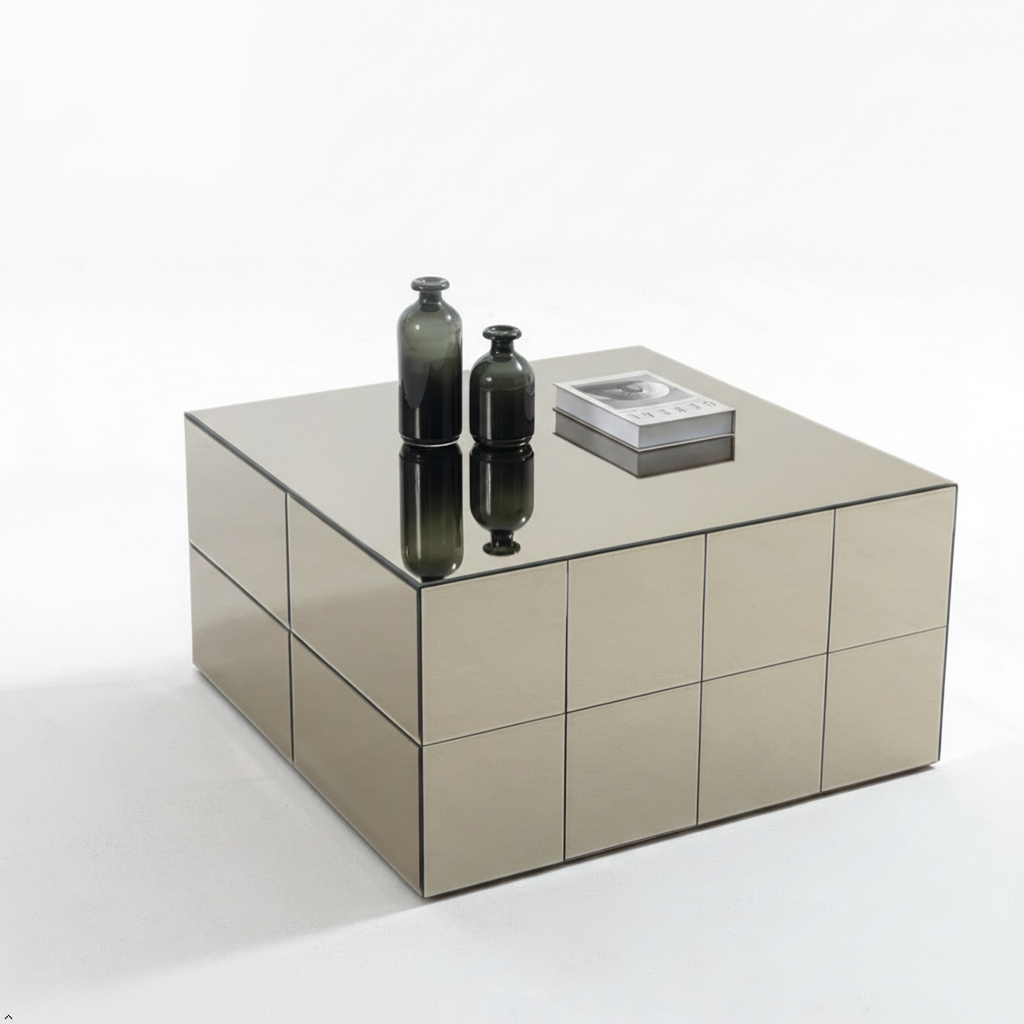 Mirrored coffee table with decorative items on a white background