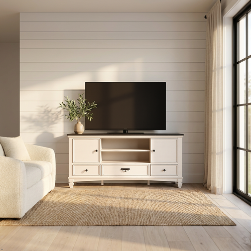 Living room with a white entertainment console, TV, and decorative plant.
