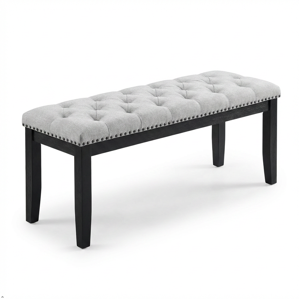 Gray tufted bench with black legs on a white background