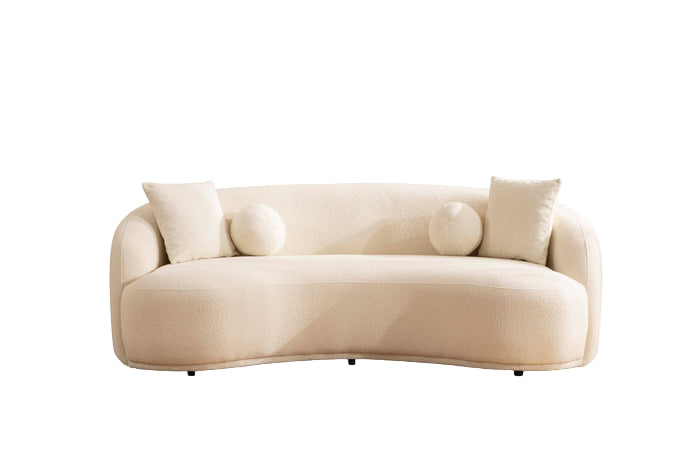 Beige sofa with curved design on a white background