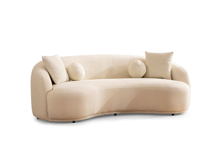 Beige sofa with decorative cushions on a white background