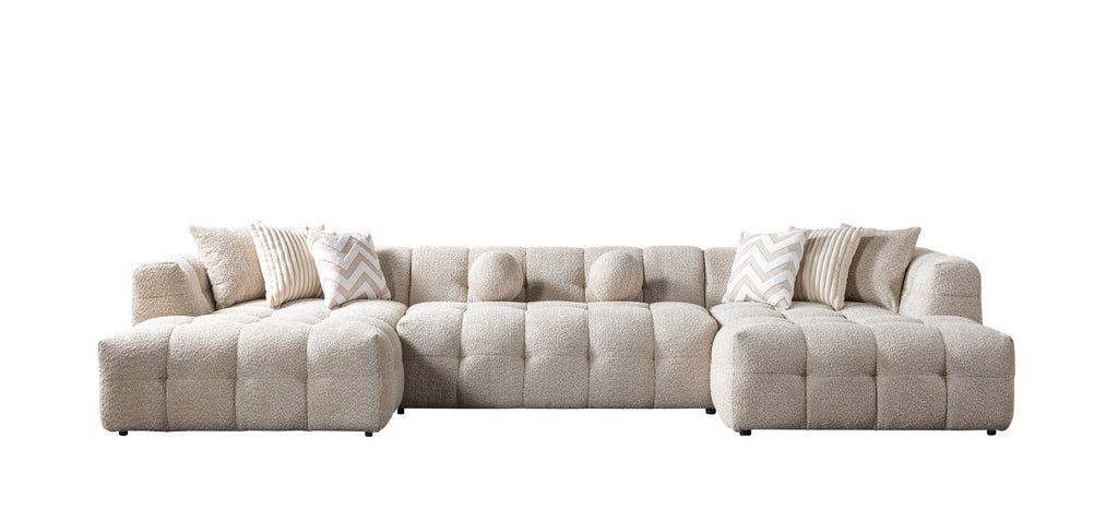 Beige sectional sofa with cushions on a white background