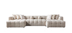 Beige sectional sofa with cushions on a white background