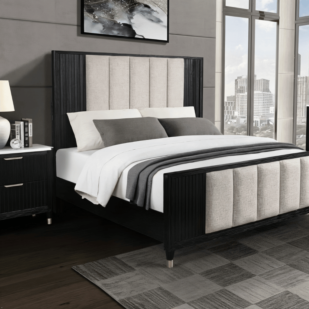 Modern bedroom with a black and gray upholstered bed, nightstands, and large windows.